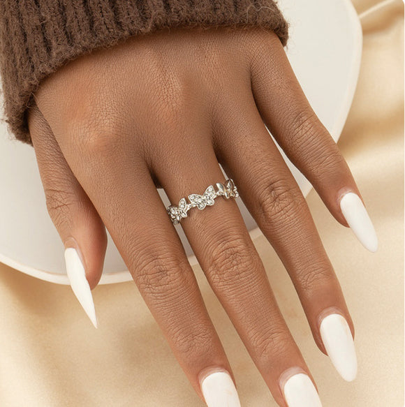 Butterfly ring encrusted with white rhinestones